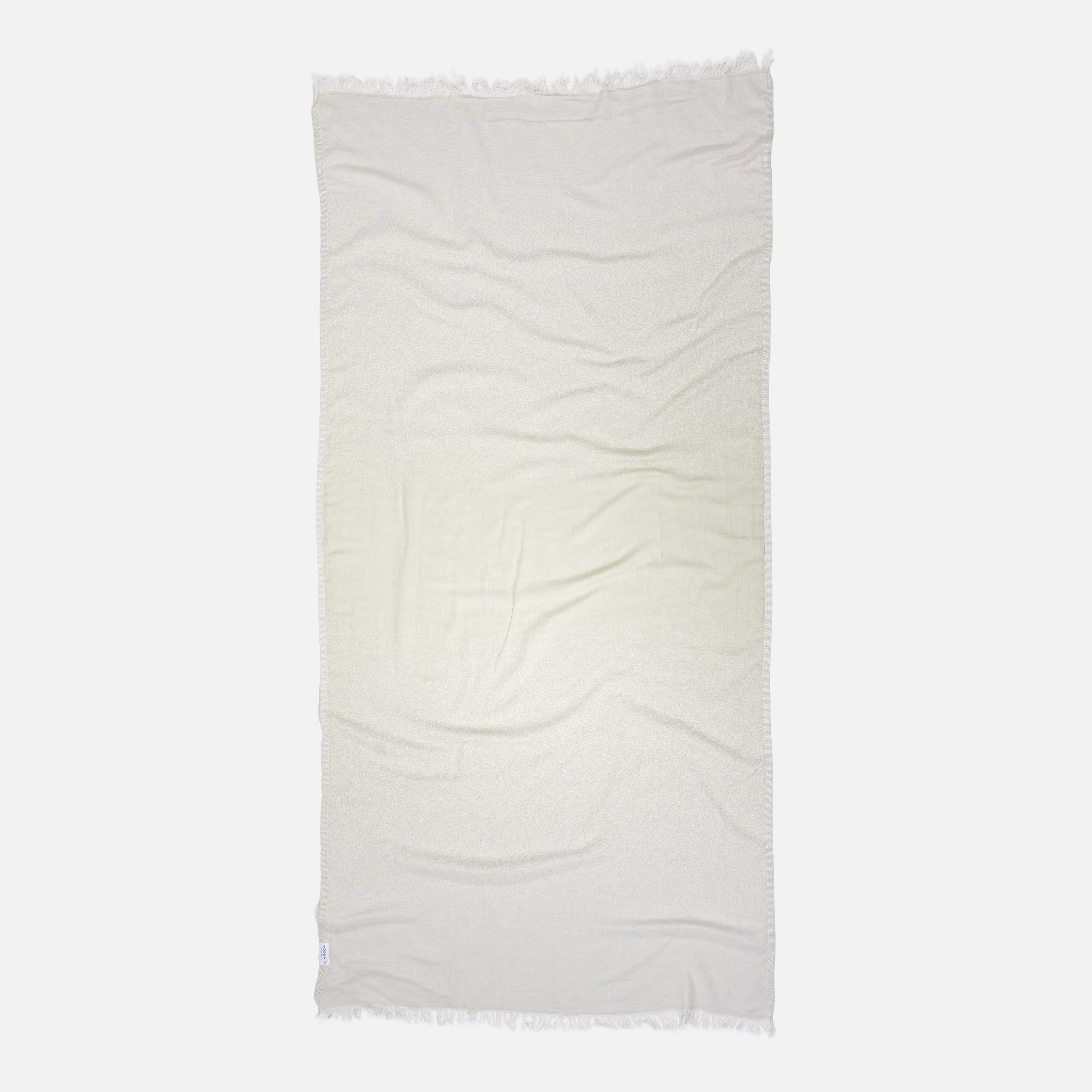 Ein luxuriöses Ecobain Hamamtuch im Design Faded, Farbton Magic Mermaid. Das Tuch besticht durch einen harmonischen Farbverlauf zwischen Salbeigrün und Ecru in innovativer Jacquard-Webung. Gefertigt aus 100 Prozent langstapeliger, gekämmter Baumwolle, ist dieses Tuch die smarte, plastikfreie Alternative zu Frottee. Extrem platzsparend, schnelltrocknend und ressourcenschonend. Das ideale Accessoire für Yoga, Wellness und entspannte Auszeiten am Wasser.